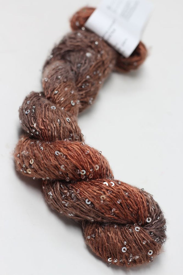 Artyarns Beaded Silk & Sequins Light beaded yarn with shimmering sequins and silk strands in a close-up view.