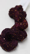 Artyarns Beaded Silk & Sequins Light beaded yarn with shiny sequins and silk fibers, shown in a close-up view.