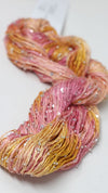 Beaded silk and sequins yarn by Artyarns, light H Series with shimmering beads and sequins, showcasing its elegant texture and sparkle.