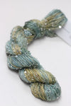 Beaded silk and sequins yarn from Artyarns' Beaded Silk & Sequins Light H Series in soft, shimmering tones.