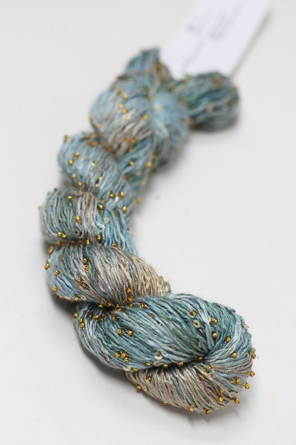 Close-up of Artyarns Beaded Silk & Sequins Light H Series yarn with shimmering beads and sequins in a soft, luxurious fiber.