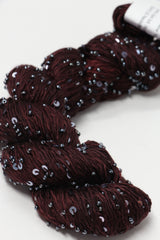 Beaded silk and sequins yarn from Artyarns' Beaded Silk & Sequins Light H Series, featuring shiny beads and delicate silk fibers.
