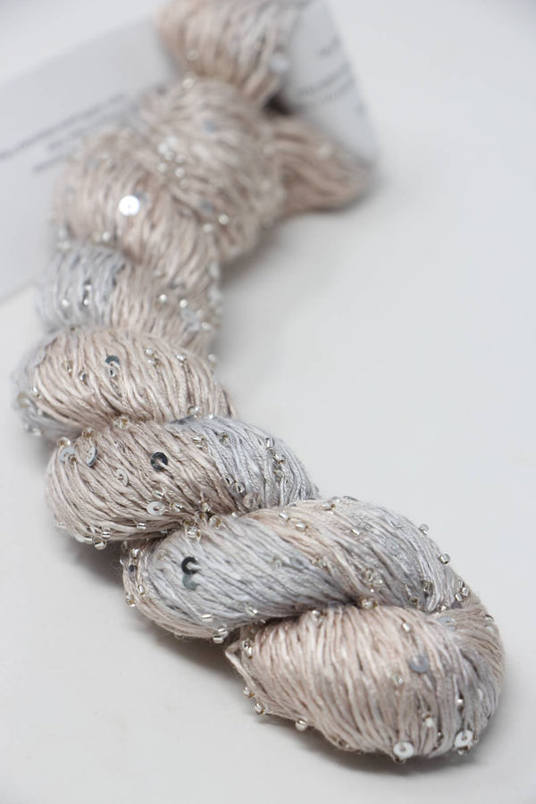 Beaded silk and sequins yarn by Artyarns, Light H Series, showing strands of shimmering beaded yarn with sequins.