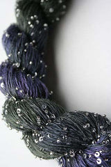 Beaded silk and sequins yarn from Artyarns' Beaded Silk & Sequins Light H Series, featuring shimmering beads and fine silk fibers.