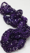 Beaded silk yarn with sequins from Artyarns' Beaded Silk & Sequins Light series, showing shimmering beaded threads and sequins.