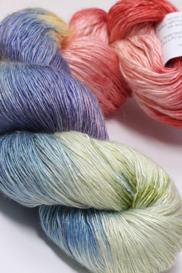 Soft close-up of Artyarns Ensemble Light cashmere yarn in F Series colors, showcasing its luxurious texture and vibrant hues.