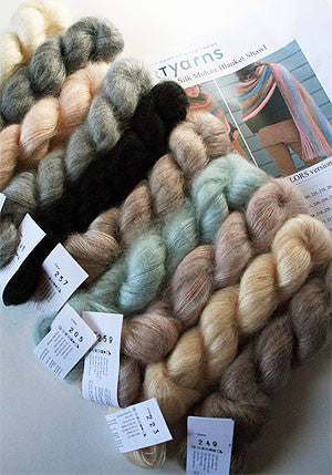 Artyarns Silk Mohair Blanket Kit with neutral-colored yarns and knitting supplies for cozy, luxurious blankets.