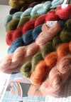 Artyarns Silk Mohair Blanket Kit with colorful yarn skeins for knitting, showcasing soft, luxurious silk and mohair fibers.