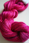 Close-up of Artyarns Silk Essence Lace silk yarn showing its smooth, shiny texture in soft pastel shades.