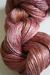 Close-up of Artyarns Silk Essence Lace silk yarn with soft, shiny fibers in a delicate lace texture.