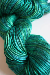 Close-up of Artyarns Silk Essence Lace silk yarn in soft, shiny strands, showcasing the luxurious texture and delicate lace finish.