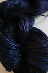 Close-up of Artyarns Silk Essence Lace silk yarn in soft, luxurious fibers with subtle sheen and delicate texture.