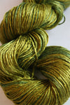 Close-up of Artyarns Silk Essence Lace silk yarn in soft, shiny fibers with subtle color variations.