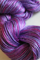 Close-up of Artyarns Silk Essence Lace silk yarn in soft, shiny fibers, showcasing its delicate texture and luxurious sheen.