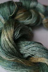 Close-up of Artyarns Silk Essence Lace silk yarn showing its soft, shiny texture and delicate lace-like appearance.