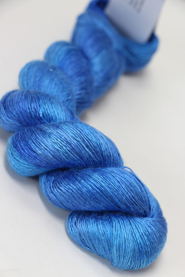 Soft silk yarn from Artyarns Silk Essence Lace collection, showcasing delicate, luxurious silk fibers in a neutral color.
