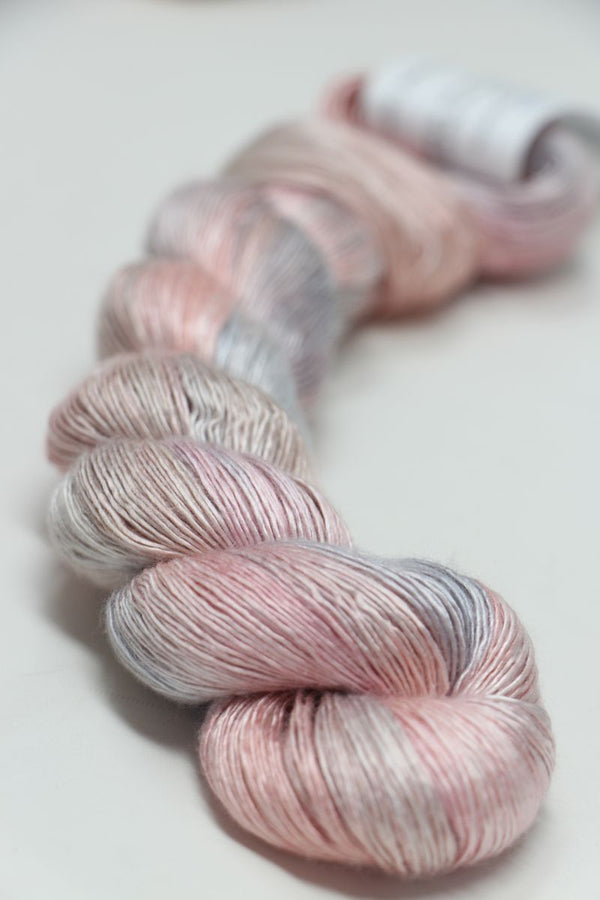 Close-up of Artyarns Silk Essence Lace silk yarn in soft, luxurious fibers, showcasing the delicate texture and elegant sheen.