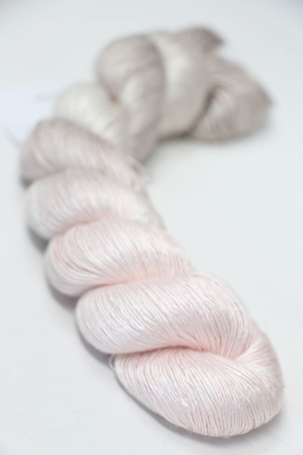 Close-up of Artyarns Silk Essence Lace silk yarn in a soft, luxurious texture with delicate color variations.