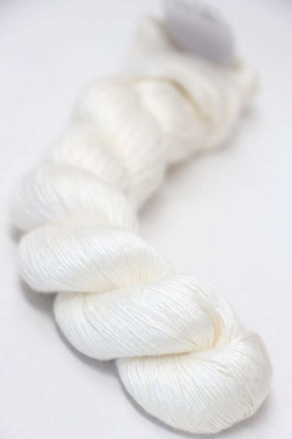 Close-up of Artyarns Silk Essence Lace silk yarn in a soft, shiny texture, showcasing its delicate and luxurious fiber quality.