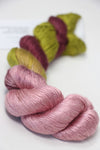 Soft silk yarn from Artyarns Silk Essence Lace collection, showcasing delicate, shiny silk strands ideal for knitting or crochet projects.