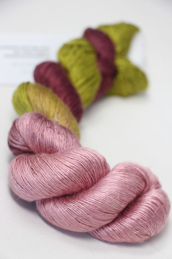 Soft silk yarn from Artyarns Silk Essence Lace collection, showcasing delicate, shiny silk strands ideal for knitting or crochet projects.