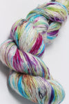 Colorful skein of Artyarns Ensemble Light yarn in Cosmic Colors, showcasing vibrant, soft-textured knitting yarn.