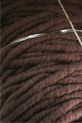 Close-up of Bagmith Merino Wool Bumps in chocolate color, showing soft, textured merino wool fabric with small, rounded bumps.