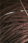 Close-up of Bagmith Merino Wool Bumps in chocolate color, showing soft, textured merino wool fabric with small, rounded bumps.