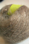 Dark camel Be Sweet medium brushed mohair yarn ball, soft and textured fiber for knitting or crochet projects.