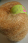 Be Sweet medium brushed mohair yarn in wheat color, showcasing soft, textured fibers ideal for knitting or crochet projects.