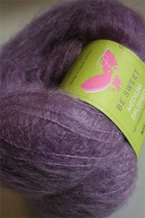 Soft amethyst Be Sweet Medium Brushed Mohair yarn, showcasing its fluffy texture and vibrant color for knitting or crocheting projects.