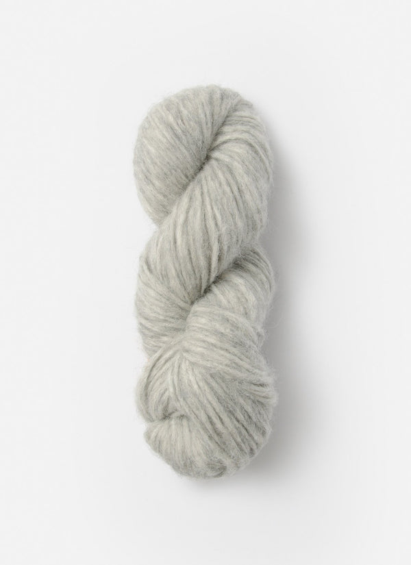 Blue Sky Fibers Techno alpaca, silk, and merino yarn skein showing soft, vibrant blue fibers with a smooth texture and luxurious appearance.
