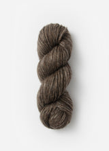Blue Sky Fibers Techno alpaca, silk, and merino yarn in a rich blue color, showing the soft, textured fiber bundle.