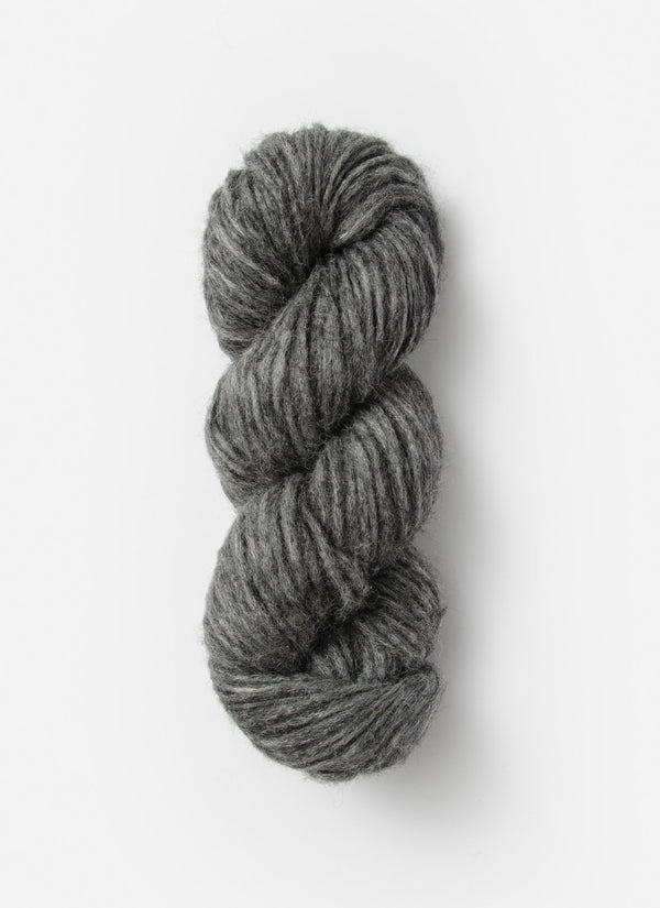 Blue Sky Fibers Techno Alpaca, Silk, and Merino yarn in a soft blue color, showcasing the fluffy, luxurious fiber texture.