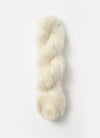 Blue Sky Fibers Brushed Suri alpaca yarn in soft blue color, showing thick, plush spun fiber with a smooth texture.
