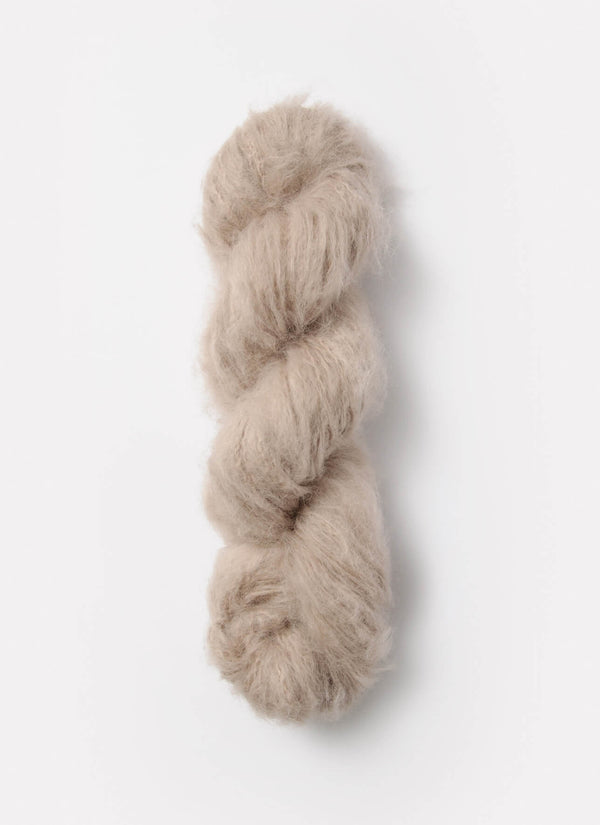 Blue Sky Fibers Brushed Suri alpaca yarn in soft blue, showcasing its fluffy, brushed texture and luxurious fiber quality.