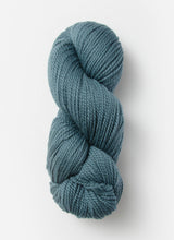 Blue Sky Fibers Extra Alpaca Merino Aran yarn in soft blue, showing thick, cozy alpaca wool skein with a smooth texture.