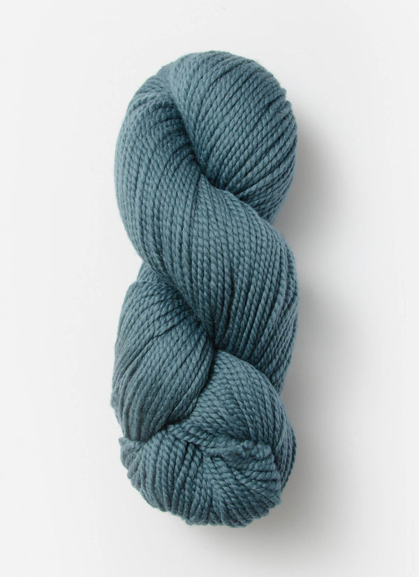 Blue Sky Fibers Extra Alpaca Merino Aran yarn in soft blue, showing thick, cozy alpaca wool skein with a smooth texture.