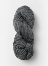 Blue Sky Fibers Extra Alpaca Merino Aran yarn in soft blue, showing thick, cozy alpaca wool skein with textured fibers.