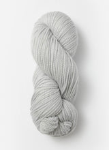 Blue Sky Fibers Extra Alpaca Merino aran yarn in soft blue, showing thick, cozy wool with a smooth texture.