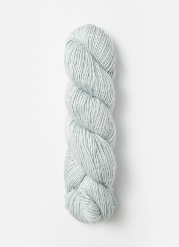 Blue Sky Fibers Suri Merino alpaca and merino yarn in soft blue, showcasing the smooth, fiber-rich texture of the yarn.