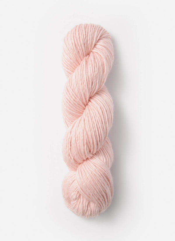 Blue Sky Fibers Suri Merino alpaca and merino yarn in natural blue hue, showcasing soft, luxurious fiber strands.