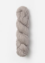 Blue Sky Fibers Suri Merino alpaca and merino yarn in soft blue, showing its smooth, luxurious fiber texture.