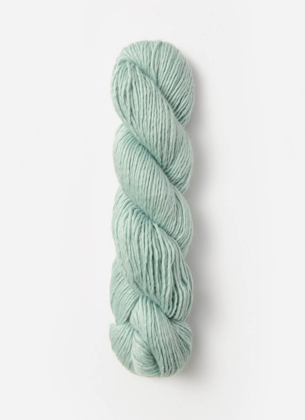 Blue Sky Fibers Suri Merino alpaca and merino yarn in soft blue, showing its smooth texture and luxurious fiber blend.