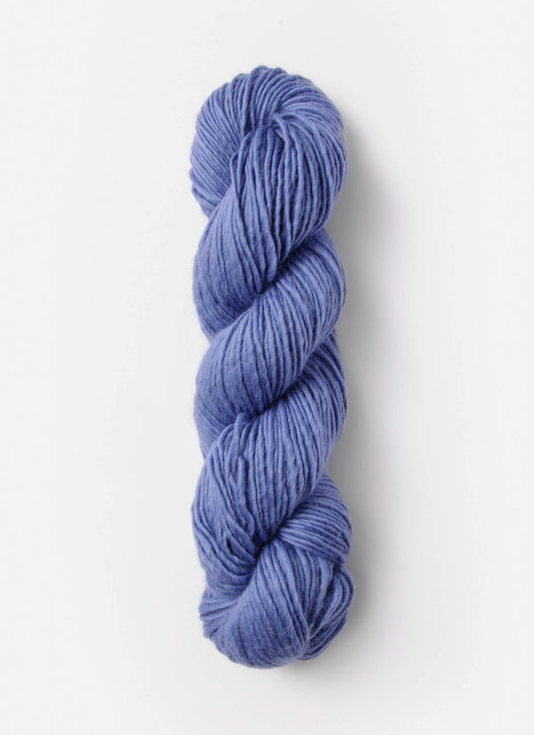 Blue Sky Fibers Suri Merino alpaca and merino yarn in soft blue, displayed in a close-up shot showing its smooth texture.