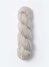 Blue Sky Fibers Suri Merino alpaca and merino yarn in soft blue, showcasing its smooth, fluffy texture and vibrant color.