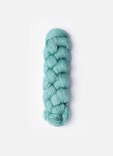 Blue Sky Fibers Metalico alpaca yarn in a rich, shiny blue color, showcasing its soft, luxurious texture and metallic sheen.