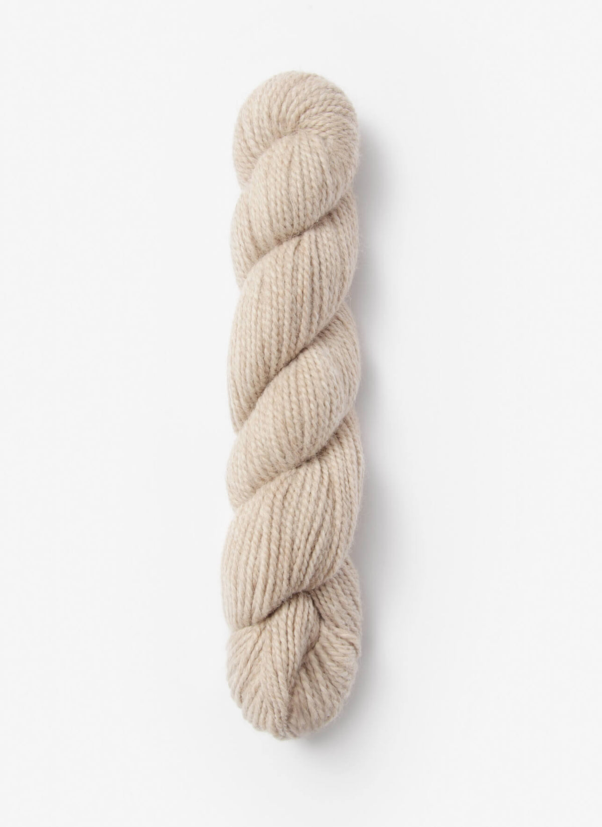Blue Sky Fibers Baby Alpaca Sport Weight solid alpaca yarn in soft blue, showing the smooth, lightweight fiber strands.