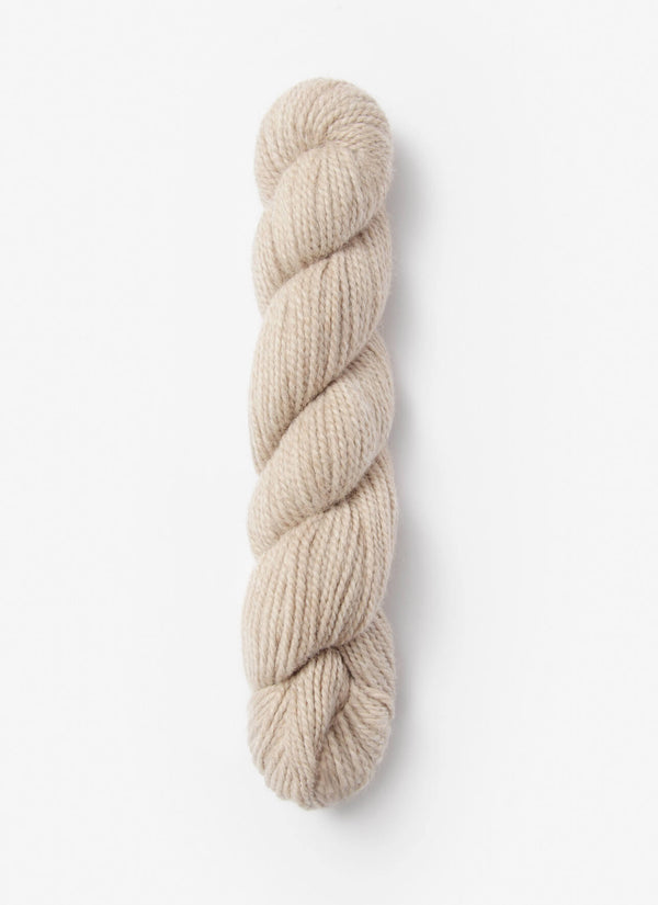 Blue Sky Fibers Baby Alpaca Sport Weight solid alpaca yarn in soft blue, showing the smooth, lightweight fiber strands.