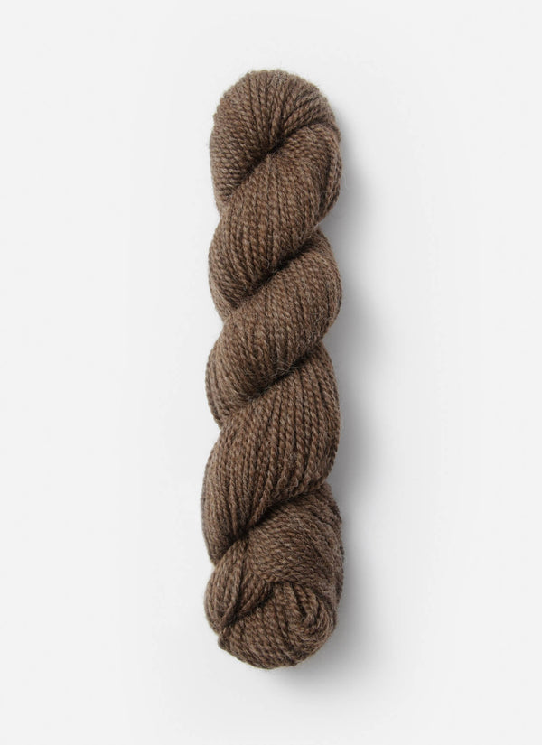 Blue Sky Fibers Baby Alpaca Sport Weight solid alpaca yarn in a soft blue color, showing the smooth, spun fiber texture.